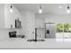 Well-lit kitchen with quartz countertops, stainless appliances, and pendant lighting at 17434 Sw 36Th Avenue Rd, Ocala, FL 34473