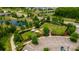 Aerial view of the community dog park, featuring fenced areas, shelters, and landscaping at 17840 Passionflower Cir, Clermont, FL 34714