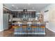 Beautiful kitchen with stainless steel appliances, dark cabinetry, white countertops, and barstool seating at 17840 Passionflower Cir, Clermont, FL 34714