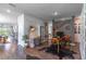 Open-concept living area featuring hardwood floors, neutral paint, designer decor, and lots of natural light at 17840 Passionflower Cir, Clermont, FL 34714