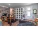 Interior space displaying a large wardrobe, a desk setup, unique decor, and bright natural light at 17840 Passionflower Cir, Clermont, FL 34714