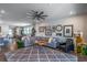 Spacious living room featuring an open floor plan, hardwood floors, cozy seating, and stylish decor at 17840 Passionflower Cir, Clermont, FL 34714