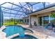 Inviting screened-in pool and spa area, perfect for outdoor entertaining and relaxation at 17840 Passionflower Cir, Clermont, FL 34714