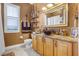 A uniquely decorated bathroom featuring bronze fixtures, a decorative sink, and shuttered window at 190 Osprey Hammock Trl, Sanford, FL 32771