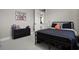 Bedroom with a bed frame and a shelf with drawers at 190 Osprey Hammock Trl, Sanford, FL 32771