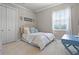 Cozy bedroom features plush carpet, neutral walls, and a stylish decor at 190 Osprey Hammock Trl, Sanford, FL 32771