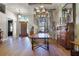 Formal dining room with chandelier, hardwood floors, and a large wooden dining table at 190 Osprey Hammock Trl, Sanford, FL 32771