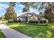 Beautifully landscaped front yard showcasing the home's architectural design and curb appeal at 190 Osprey Hammock Trl, Sanford, FL 32771