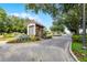 Welcoming gated entrance with stone guard house and manicured landscaping adds security and curb appeal to the community at 190 Osprey Hammock Trl, Sanford, FL 32771