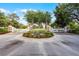 Gated entrance with landscaping and manicured flower beds provides a secure and attractive entry to the neighborhood at 190 Osprey Hammock Trl, Sanford, FL 32771