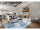 Inviting living room with custom ceiling, comfortable seating, hardwood floors, and open access to kitchen at 190 Osprey Hammock Trl, Sanford, FL 32771