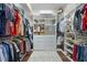 Spacious walk-in closet with custom shelving and storage solutions for organized wardrobe and accessories at 190 Osprey Hammock Trl, Sanford, FL 32771