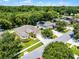 Beautiful aerial view of the house surrounded by lush landscaping and neighboring homes in a serene setting at 2026 Winding Oaks Dr, Orlando, FL 32825