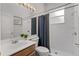 Well-lit bathroom with vanity sink, toilet, and shower with curtain at 2026 Winding Oaks Dr, Orlando, FL 32825