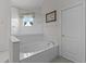 Relaxing bathroom with a soaking tub, separate shower, and modern finishes at 2026 Winding Oaks Dr, Orlando, FL 32825