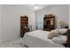 Bedroom with a wooden bed frame, built in bookcases, and ceiling fan at 2026 Winding Oaks Dr, Orlando, FL 32825