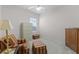 Bedroom featuring a chair, storage chest, and window at 2026 Winding Oaks Dr, Orlando, FL 32825
