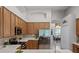 Spacious kitchen with modern appliances and wood cabinets at 2026 Winding Oaks Dr, Orlando, FL 32825