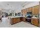 Open-concept kitchen featuring stainless steel appliances and lots of wooden cabinets at 2026 Winding Oaks Dr, Orlando, FL 32825