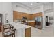 Modern kitchen features stainless steel appliances, a breakfast bar, and ample cabinet space at 2026 Winding Oaks Dr, Orlando, FL 32825
