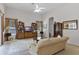 Spacious living room with vaulted ceilings and large windows for ample natural light at 2026 Winding Oaks Dr, Orlando, FL 32825
