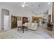 Bright and airy living space with an open layout to the kitchen and dining areas at 2026 Winding Oaks Dr, Orlando, FL 32825