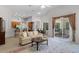 Open-concept living area seamlessly connects the kitchen, dining space, and screened patio at 2026 Winding Oaks Dr, Orlando, FL 32825