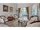 Comfortable living room with plush seating, a decorative rug, and sliding glass doors to the lanai at 2026 Winding Oaks Dr, Orlando, FL 32825
