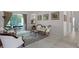 Elegant living room with classic furnishings and a view to the screened lanai at 2026 Winding Oaks Dr, Orlando, FL 32825