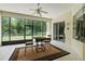 Enclosed patio featuring ceiling fan, tiled floors, and a view of the fenced backyard at 2026 Winding Oaks Dr, Orlando, FL 32825