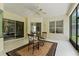 Relaxing sunroom with tiled floors, ceiling fan, and sliding glass doors at 2026 Winding Oaks Dr, Orlando, FL 32825
