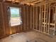 Spacious bedroom framed for a large window and ready for customization at 2371 Zuni Road, St Cloud, FL 34771