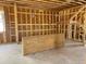 Incomplete kitchen space with exposed studs, plumbing, and electrical awaits personalization at 2371 Zuni Road, St Cloud, FL 34771