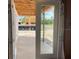 A covered back patio and view of the backyard with new home construction at 2371 Zuni Road, St Cloud, FL 34771