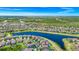 Scenic aerial view featuring a lakeside community with well-manicured lawns and numerous residences at 2209 Crofton Ave, Davenport, FL 33837