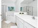 Bright bathroom with double vanity, soaking tub, and glass enclosed shower at 2209 Crofton Ave, Davenport, FL 33837