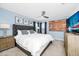 Comfortable bedroom with a tufted headboard, neutral tones, and ceiling fan at 2209 Crofton Ave, Davenport, FL 33837