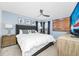 Comfortable bedroom with a tufted headboard, neutral tones, and ceiling fan at 2209 Crofton Ave, Davenport, FL 33837