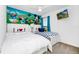 bedroom with colorful Disney decor and white furniture at 2209 Crofton Ave, Davenport, FL 33837