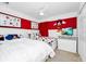 Bright bedroom with Disney themed decor and two twin beds at 2209 Crofton Ave, Davenport, FL 33837
