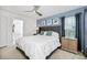 Comfortable bedroom featuring blue accents, large windows, and stylish furnishings at 2209 Crofton Ave, Davenport, FL 33837