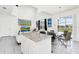 Bright kitchen featuring white cabinetry, granite countertops, and stainless steel appliances at 2209 Crofton Ave, Davenport, FL 33837