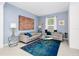 Bright living room with stylish decor, comfortable seating, and a large window for natural light at 2209 Crofton Ave, Davenport, FL 33837