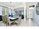 Bright open-concept living space connecting to the dining area, featuring elegant decor and lots of natural light at 2209 Crofton Ave, Davenport, FL 33837