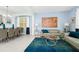 Open-concept living and dining area with modern furnishings, elegant decor, and plenty of natural light at 2209 Crofton Ave, Davenport, FL 33837
