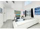 Bright living room with soaring ceilings, modern decor, a large sectional sofa, and plenty of natural light at 2209 Crofton Ave, Davenport, FL 33837