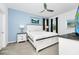 A spacious main bedroom with a king bed, accent wall, and carpeted floors at 2209 Crofton Ave, Davenport, FL 33837