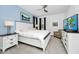 A spacious main bedroom with a king bed, accent wall, and carpeted floors at 2209 Crofton Ave, Davenport, FL 33837