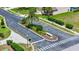A landscaped neighborhood entrance includes a roundabout and street signage at 2209 Crofton Ave, Davenport, FL 33837