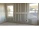 Spacious bedroom showing drywall work, featuring dual windows bringing in natural light at 2371 Zuni Road, St Cloud, FL 34771
